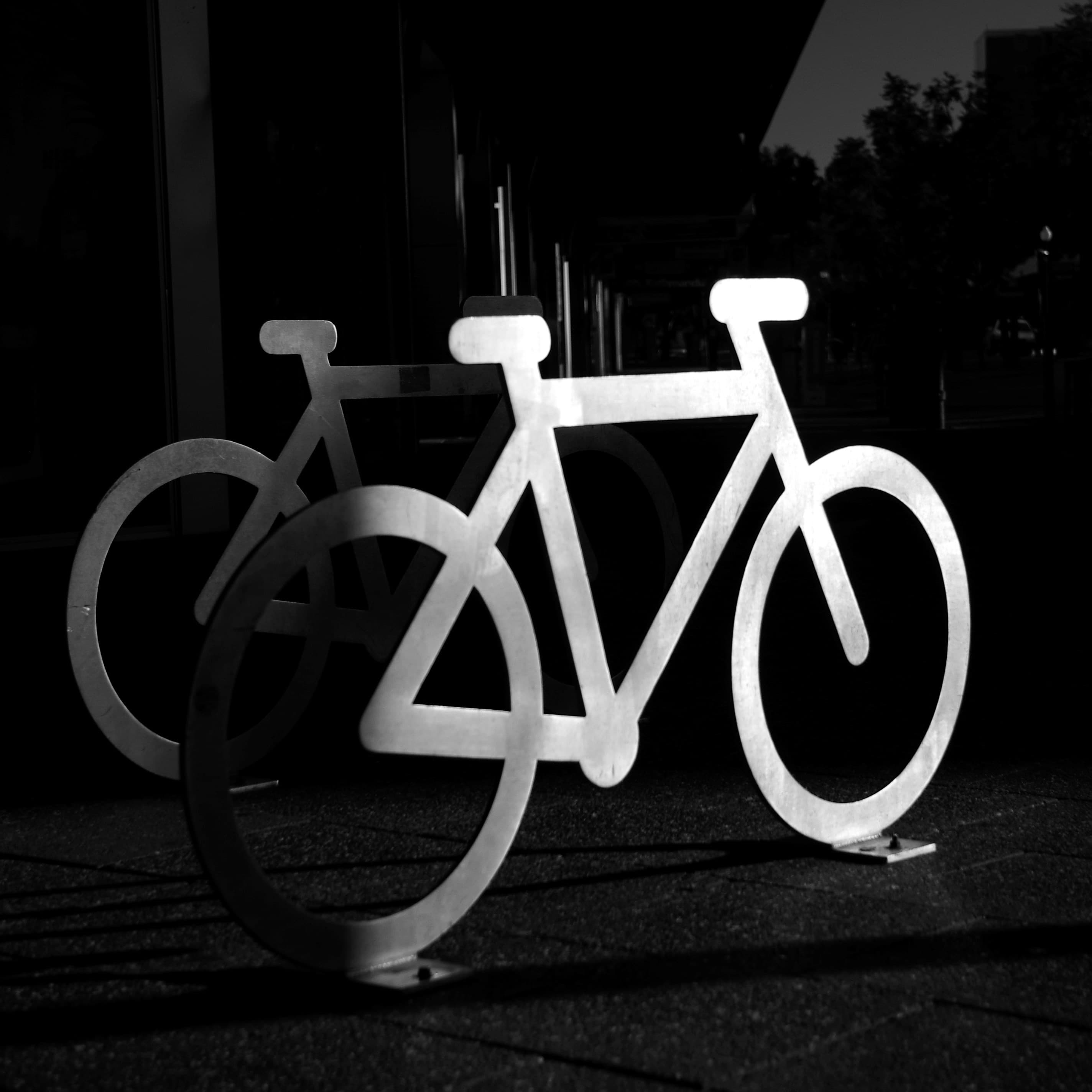 A black and white photo of a bike rack